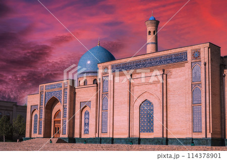 ancient medieval Muslim mosque Hazrati Imam in Tashkent in Uzbekistan. Islamic architectural complex Khast Imam at sunset with beautiful sky 114378901