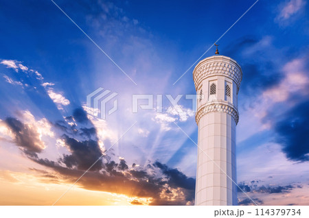marble white minaret of new Minor Mosque in Tashkent in Uzbekistan on background of beautiful blue sunset sky marble white minaret of new Minor Mosque in Tashkent in Uzbekistan on background of beautiful blue sunset sky 114379734