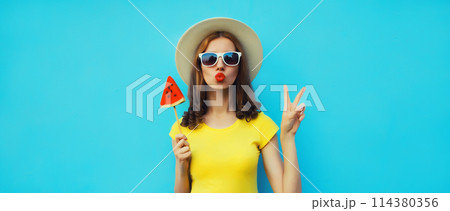 Summer portrait of stylish young woman with juicy lollipop or ice cream shaped slice of watermelon 114380356
