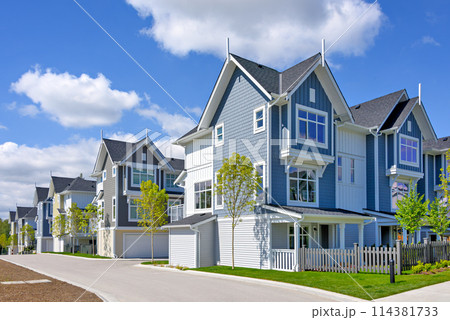 A perfect neighborhood. Brand new townhouses district on blue sky background 114381733