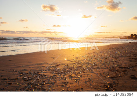 Sea meets sky in a picturesque sunset panorama. 114382084
