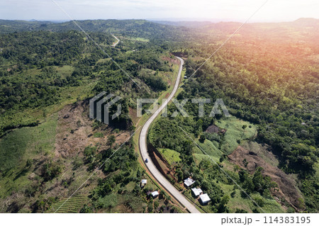 Lorry driving on mountain road 114383195