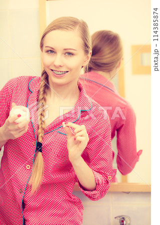 Woman applying moisturizing skin cream. Skincare. 114385874