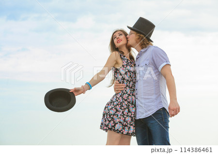 Couple flirting on date, man kissing woman 114386461