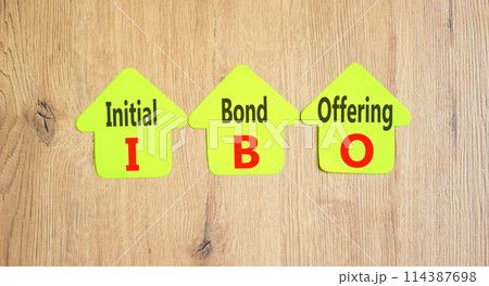 IBO initial bond offering symbol. Concept words IBO initial bond offering on beautiful yellow paper. Beautiful wooden background. Business IBO initial bond offering concept. Copy space. IBO initial bond offering symbol. Concept words IBO initial bond offering on beautiful yellow paper. Beautiful wooden background. Business IBO initial bond offering concept. Copy space. 114387698