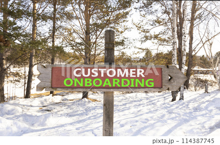 Customer onboarding symbol. Concept words Customer onboarding on beautiful wooden road sign. Beautiful forest snow blue sky background. Business Customer onboarding concept. Copy space. 114387745