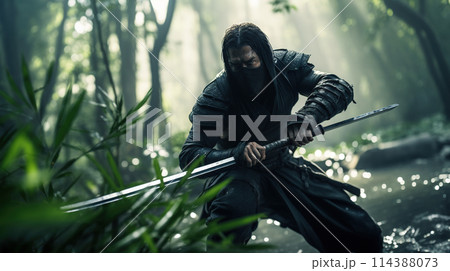 Action shot of a martial arts warrior in the bamboo forest. Cinematic dynamic scene in action movie blockbuster style. 114388073