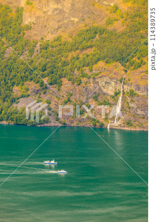 Cruise ship on norwegian fjord 114389735
