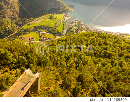 Tourist enjoying fjord view on Stegastein viewpoint Norway Tourist enjoying fjord view on Stegastein viewpoint Norway 114389809