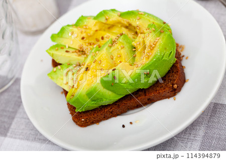 Healthy open avocado sandwich with rye bread Healthy open avocado sandwich with rye bread 114394879