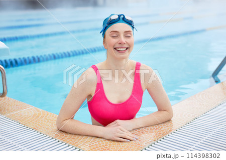 joyful smiling woman enjoys her holiday 114398302