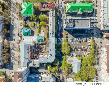 Urban landscape with numerous buildings, trees and residential areas 114399158