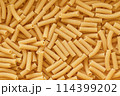 Chaotic Pile of Uncooked Rigatoni Pasta Background. Italian Pasta Tortiglioni 114399202