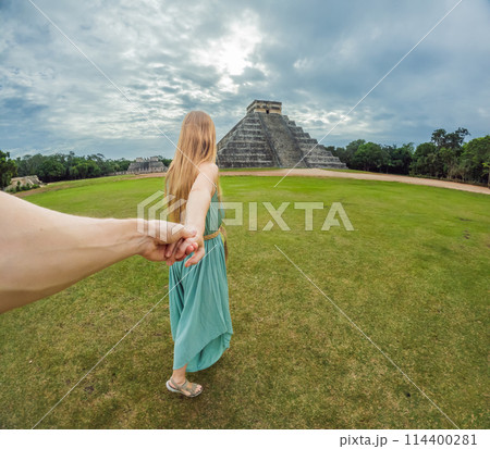 Beautiful tourist woman observing the old pyramid and temple of the castle of the Mayan architecture known as Chichen Itza these are the ruins of this ancient pre-columbian civilization and part of Beautiful tourist woman observing the old pyramid and temple of the castle of the Mayan architecture known as Chichen Itza these are the ruins of this ancient pre-columbian civilization and part of 114400281