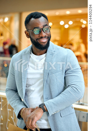 bearded man in stylish suit, jacket, watch standing at shopping mall 114400294