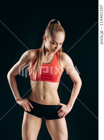 sad blond girl looking dowm tiredness after training 114401397