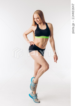sensual blond sportswoman with perfect body isolated over white background 114401647