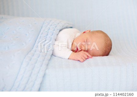 Newborn baby boy on a blue blanket Newborn baby boy on a blue blanket 114402160