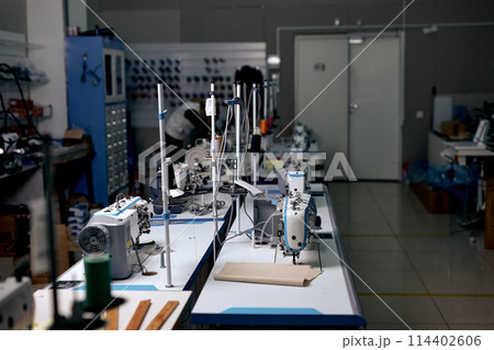 clothing manufacturing factory. sewing department, tailor's sewing room, no people clothing manufacturing factory. sewing department, tailor's sewing room, no people 114402606