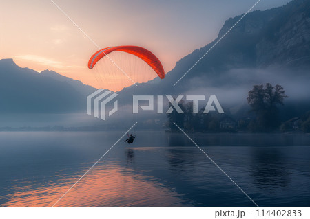 Person Para Sailing on Lake With Mountain Background 114402833