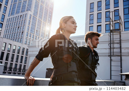 tired young people are standing and resting after working out with EMS 114403482