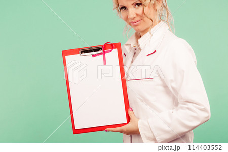 Female doctor with folder and pink ribbon Female doctor with folder and pink ribbon 114403552