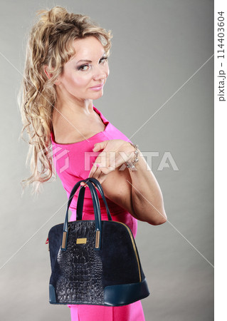 Elegant woman buyer with black bag. Elegant woman buyer with black bag. 114403604