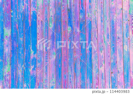 Turquoise cracked paint on the background of a wooden wall, a changed color scheme. 114403983