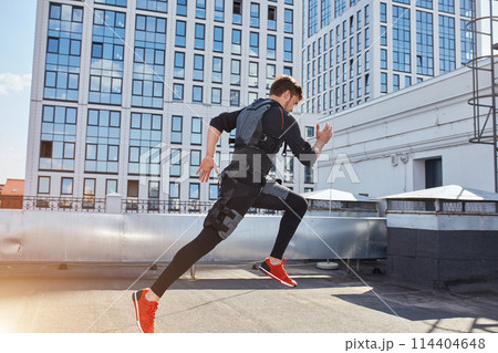 back view full length photo. strong sporty man splitting up 114404648