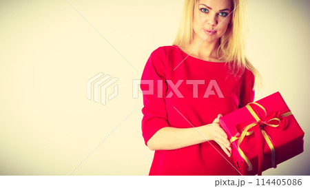 Beautiful woman with red gift. Beautiful woman with red gift. 114405086