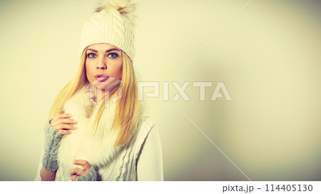 Attractive woman wearing winter clothes. 114405130