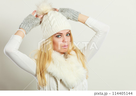 Woman wearing warm winter clothing 114405144