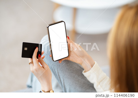 Woman Using Smartphone and Credit Card for Online Shopping 114406190