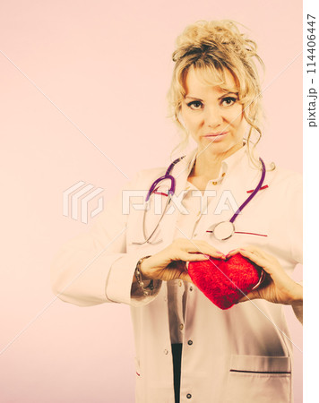 Female doctor with heart. Female doctor with heart. 114406447