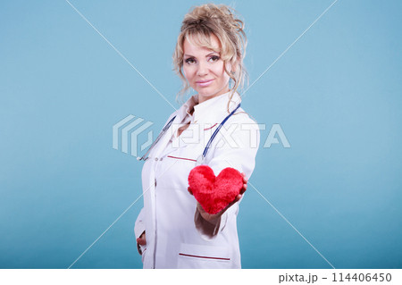Middle aged blonde doctor enjoy her work. 114406450