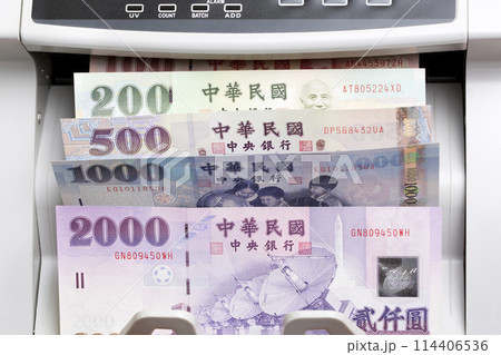 Taiwan dollar in a counting machine Taiwan dollar in a counting machine 114406536