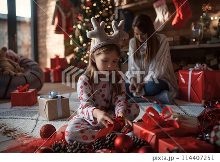 Happy children opening Christmas presents at home. Xmas holidays concept. Happy children opening Christmas presents at home. Xmas holidays concept. 114407251