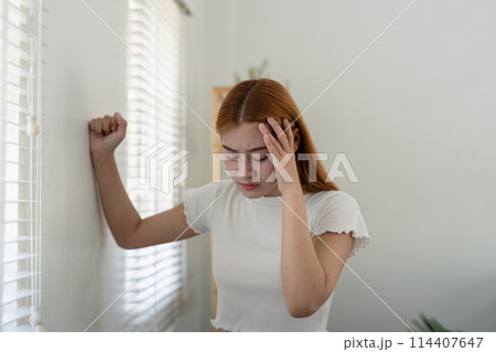 Woman asian people and health problem concept sick asian woman having headache at home 114407647