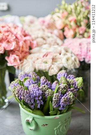 Many different flowers on Showcase. Background of mix of flowers. Beautiful flowers for catalog or online store. Floral shop and delivery concept. Many different flowers on Showcase. Background of mix of flowers. Beautiful flowers for catalog or online store. Floral shop and delivery concept. 114411212