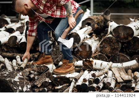 bearded mohawk Man choise firewoods for fireplace bearded mohawk Man choise firewoods for fireplace 114411924