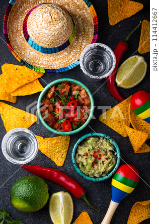 Traditional Mexican food nachos, salsa, guacamole, tequila. 114412667