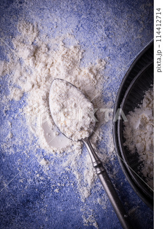 Wheat flour on dark. Baking background 114412714