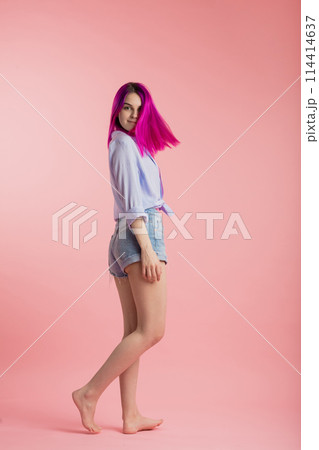 beautiful hipster with flying hair looking at the camera beautiful hipster with flying hair looking at the camera 114414637