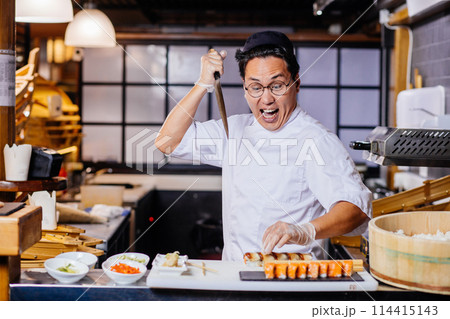 killer of sushi. funny chef having fun in sushi cafe 114415143