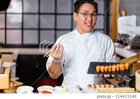 attractive gorgeous man selling sushi attractive gorgeous man selling sushi 114415148
