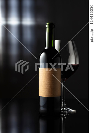 Bottle of red wine with old empty label. 114416056