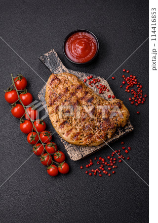 Delicious juicy pork steak with salt, spices and herbs 114416853