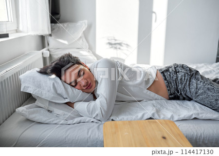 young handsome man enjoying night sleep young handsome man enjoying night sleep 114417130