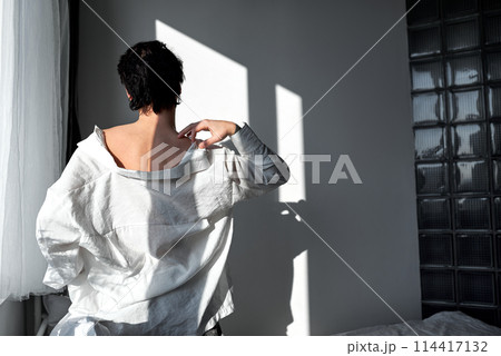 sexy young glamour man in stylish white shirt scratching his neck, shoulder sexy young glamour man in stylish white shirt scratching his neck, shoulder 114417132