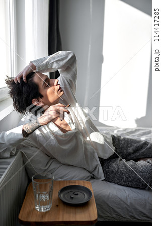 young careless man get a chill. 114417285